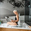 Woman in a bath tub with the Bellavita Dive