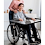 Boy sitting in a wheelchair with the adaptive desk Boy sitting in a wheelchair with the adaptive desk